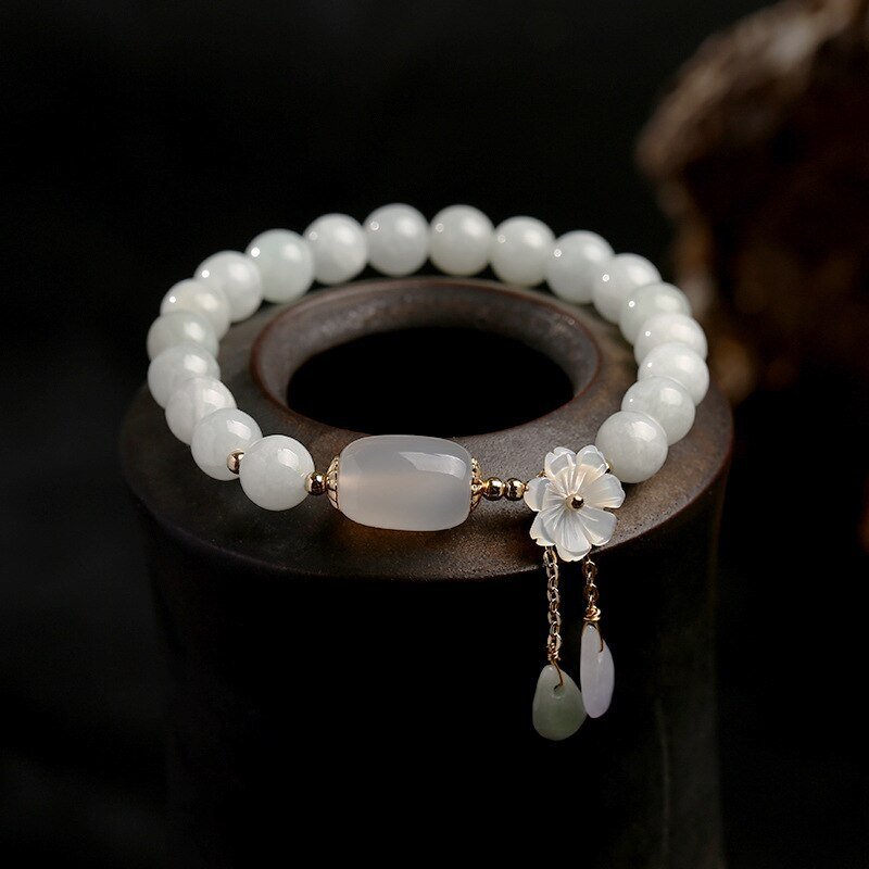 1355702020995.jpg Shell flower jade water drop bracelet