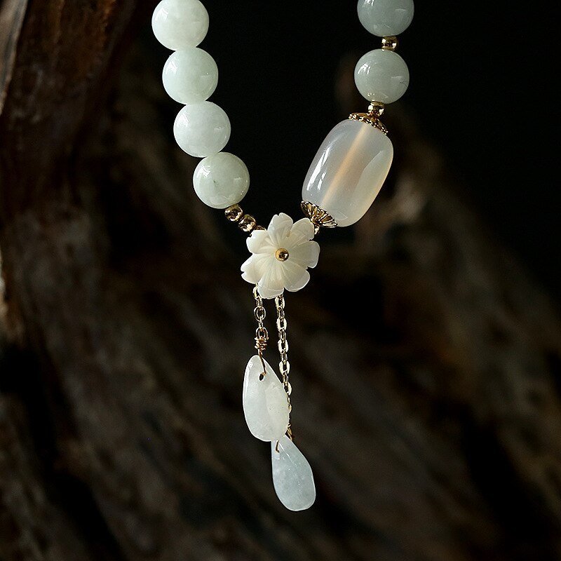 2969900007018.jpg Shell flower jade water drop bracelet