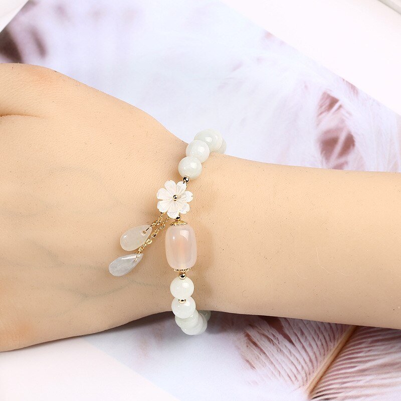 7527749859576.jpg Shell flower jade water drop bracelet
